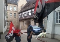 Flyer-Aktion vor Veranstaltung der Heinrich-Böll-Stiftung